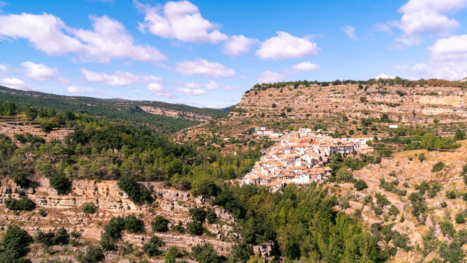Scenic view of a quaint village nestled within the mountains of Castellón, Spain.